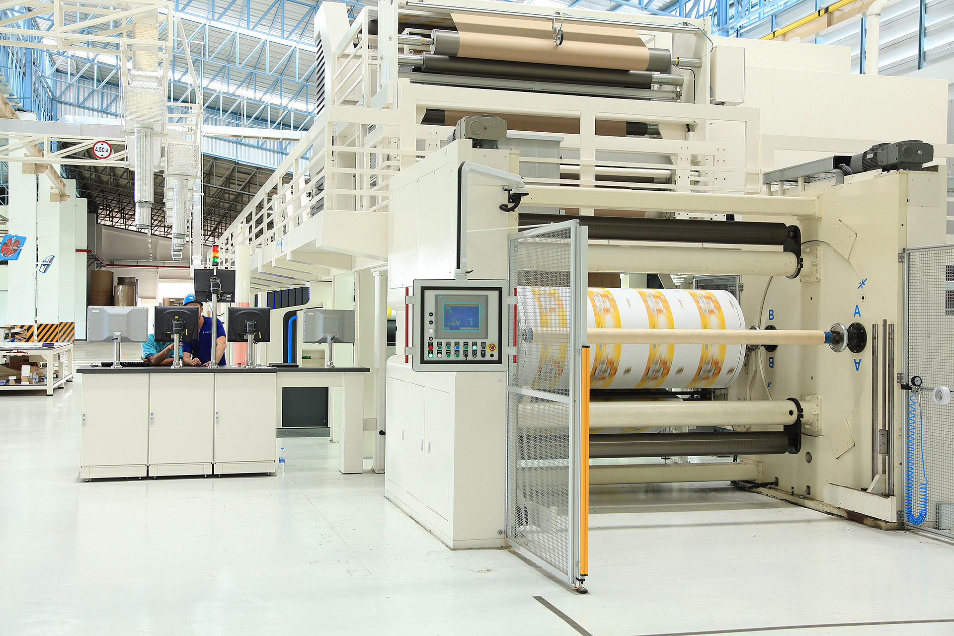 The CONPRINTA IMD press at customers site, winding a printed paper roll.