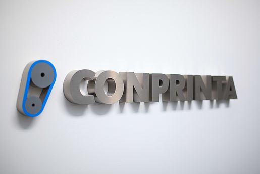 Conprinta metal lettering.