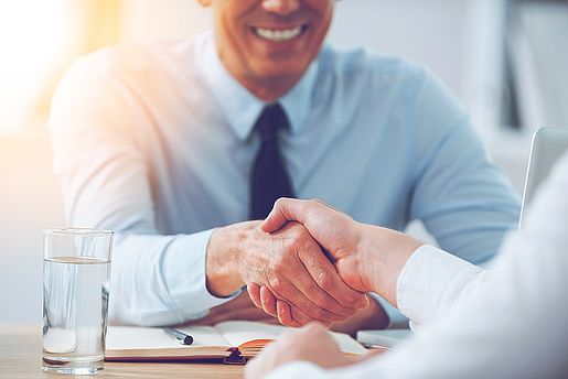 Two men shaking hands.