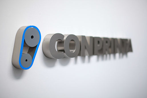 Conprinta metal lettering.